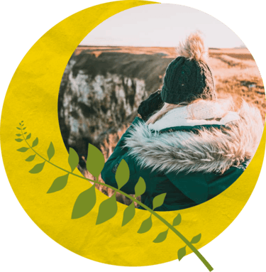 A person at a Wildlife Heritage Area inside a graphic wreath